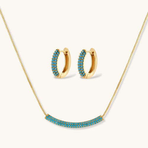 Azure Curve set: gold-tone curved pendant necklace and hoop earrings with turquoise-colored stones, front view