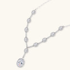 Celestial Cascade Y-necklace on its own, with an oval clear stone in a halo setting