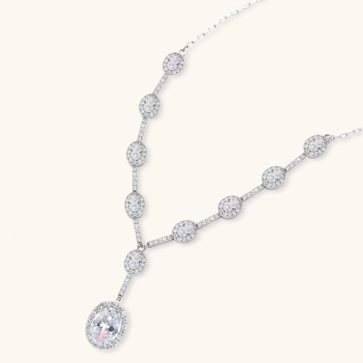 Celestial Cascade Y-necklace on its own, with an oval clear stone in a halo setting