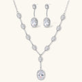 Celestial Cascade set: silver-tone Y-necklace and drop earrings with oval clear stones in halo settings, front view