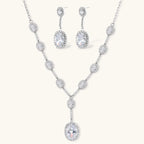 Celestial Cascade set: silver-tone Y-necklace and drop earrings with oval clear stones in halo settings, front view