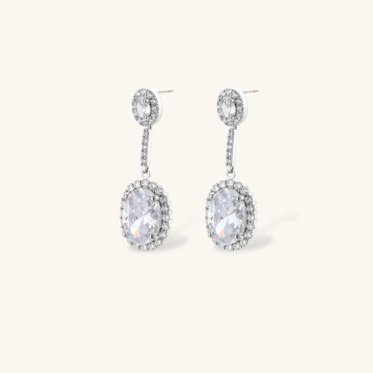 Close-up of the Celestial Cascade drop earrings with oval clear stones in halo settings