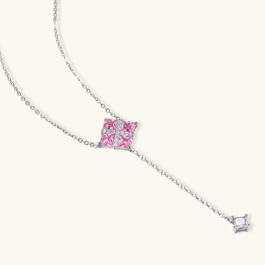 Pink Ribbon Cross Y-necklace on its own, with four pink stones under a white crossed band