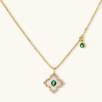 Emerald Bloom pendant necklace on its own, with a small round green charm on the chain