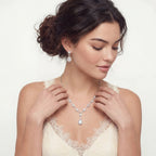 Model in a lace top wearing the Celestial Cascade necklace and earrings