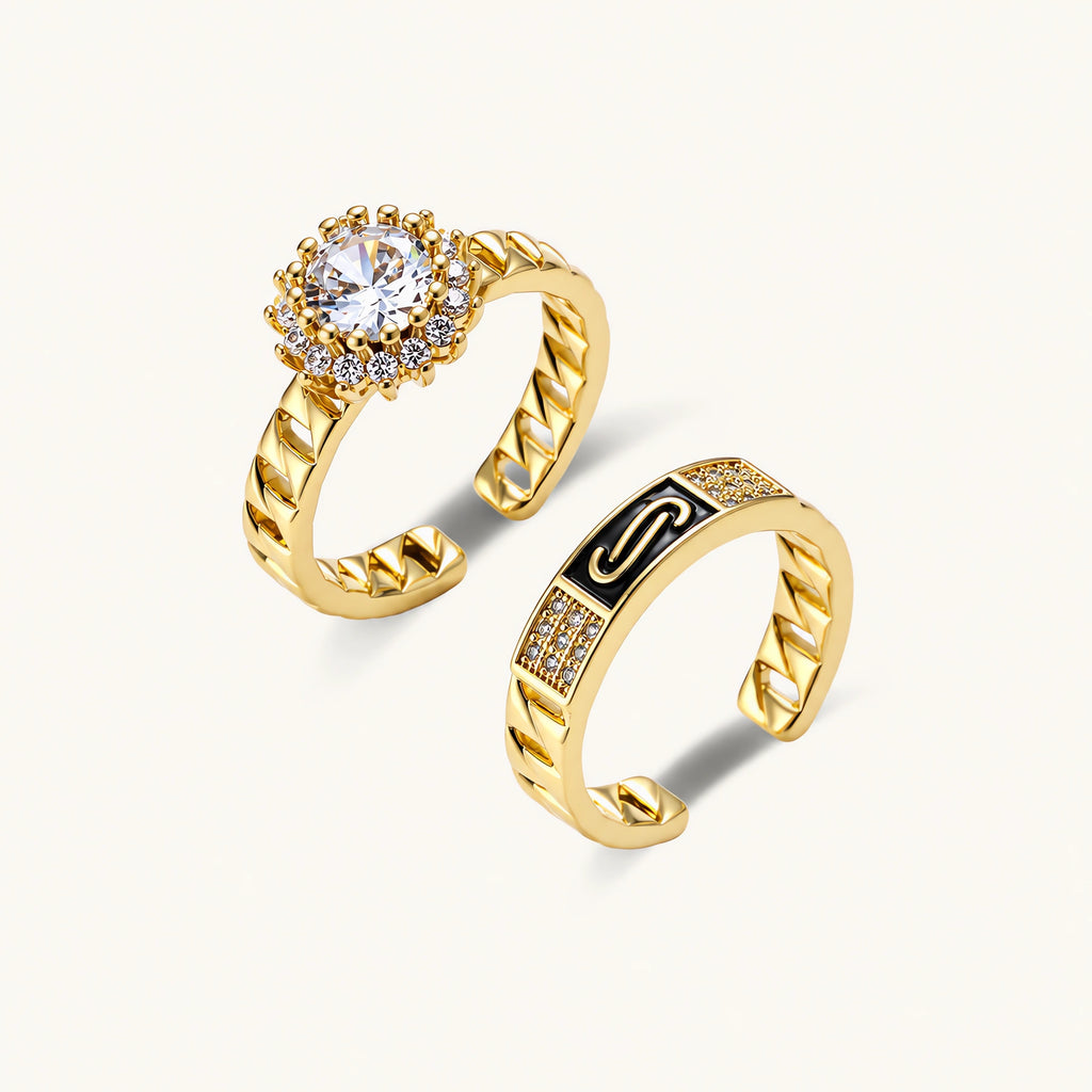 Gold-plated adjustable ring with twisted chain band, central cubic zirconia stone surrounded by crystal halo on cream background