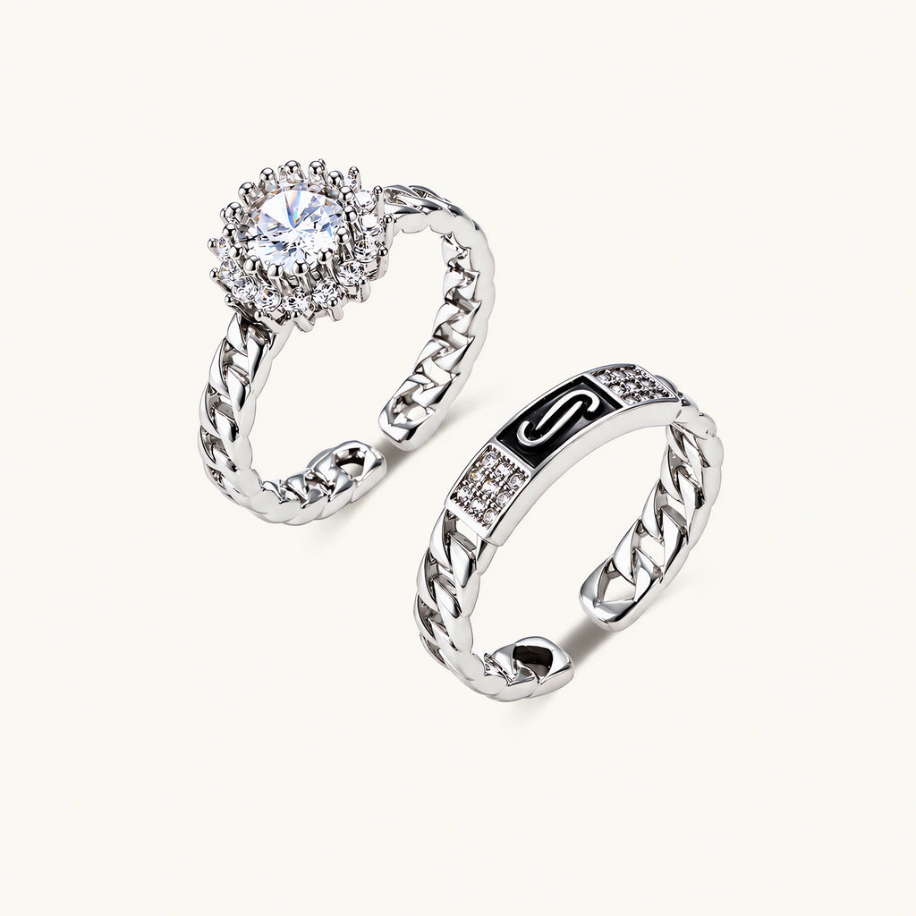 Two adjustable white gold plated rings with chain-link bands, featuring cubic zirconia halo and enamel details