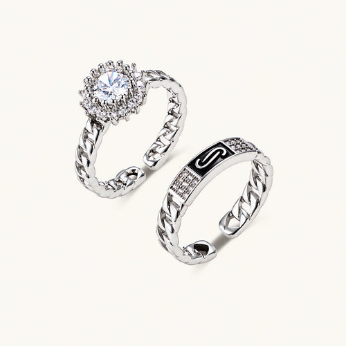 Two adjustable white gold plated rings with chain-link bands, featuring cubic zirconia halo and enamel details